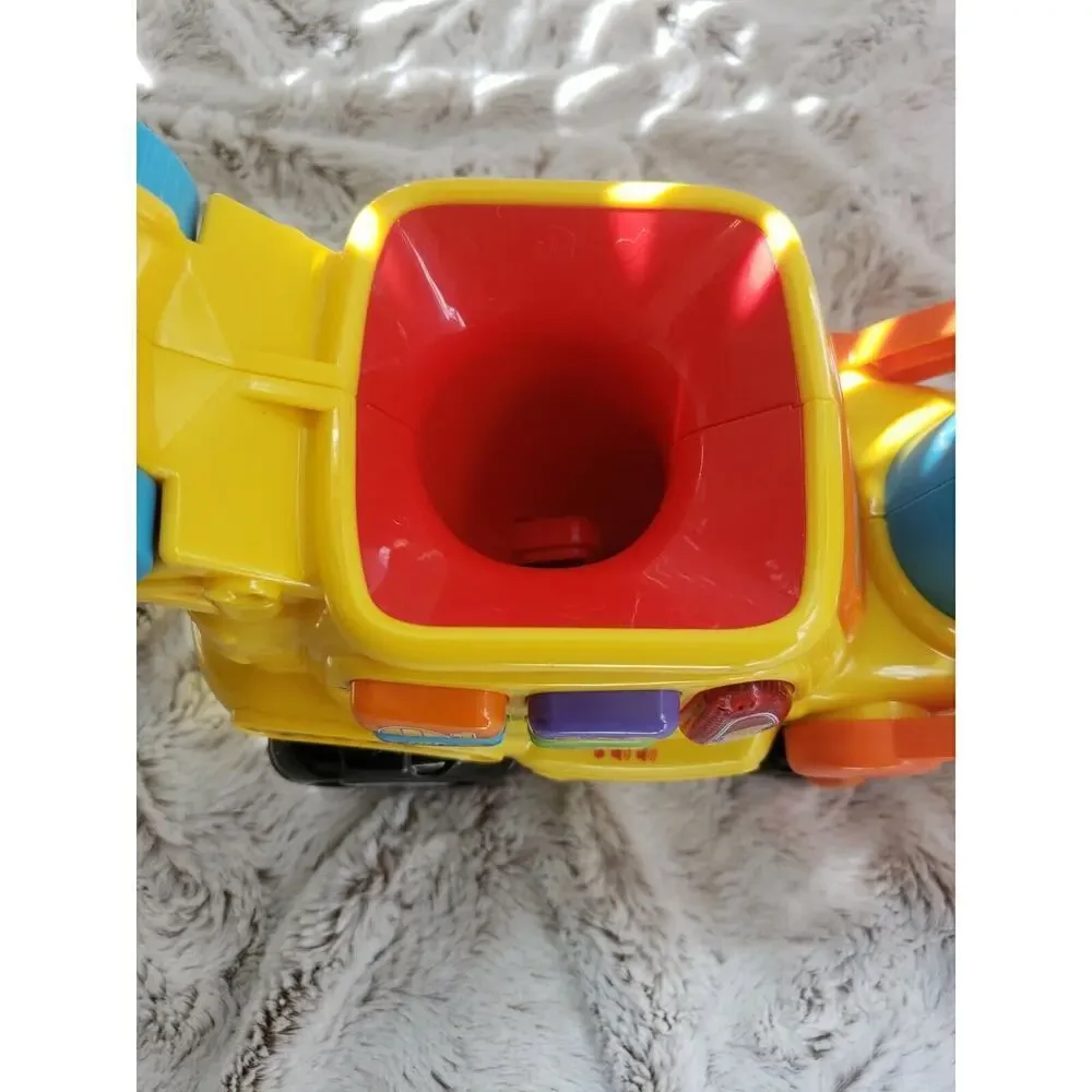 V TECH PUSH AND POP MUSICAL BULLDOZER
